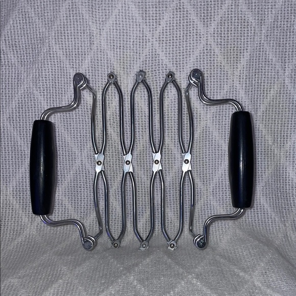 NORPRO Other - Expandable trivet with black rubber handles.